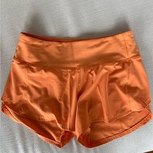 Women’s lululemon speed up mid-rise lined 4” shorts, size 4, Color: Orange Soda